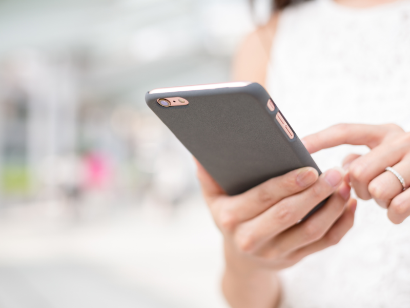 Lady texting on a mobile phone