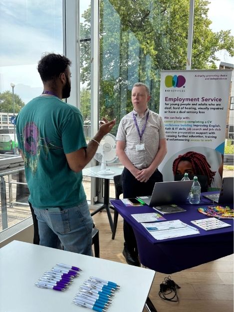 Male staff member from our employment team having a conversation in BSL.