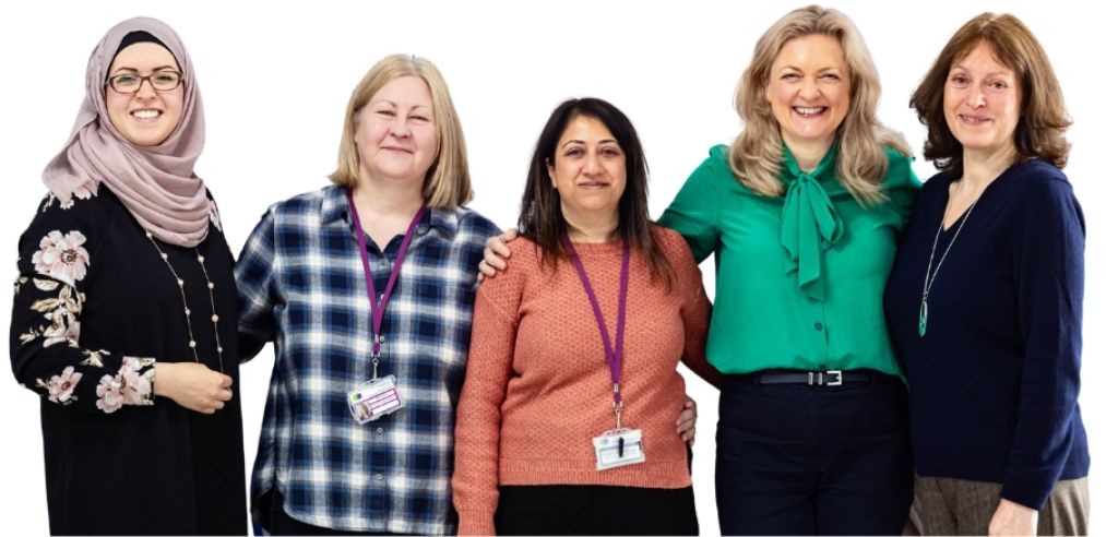 Five women from My Menopause Centre, University of Wolverhampton and BID Services stood together and smiling.