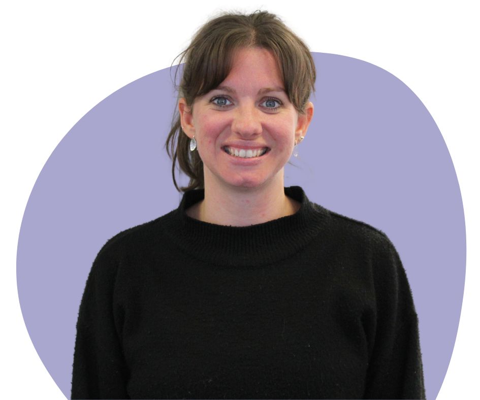 White woman with brown hair against a blue background.