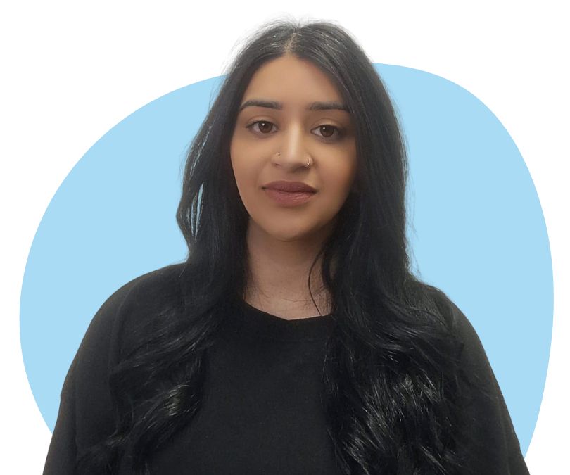 An Asian woman with long black hair against a light blue background.