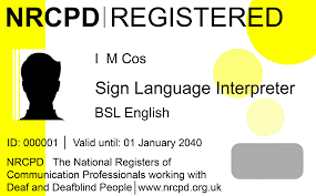 An example of an NRCPD (National Registers of Communication Professionals working with Deaf and Deafblind People) registration ID card. It shows a silhouette of a person, the name “I M Cos,” and the title “Sign Language Interpreter – BSL English.” The ID is marked as valid until 01 January 2040, with the NRCPD logo and website included.