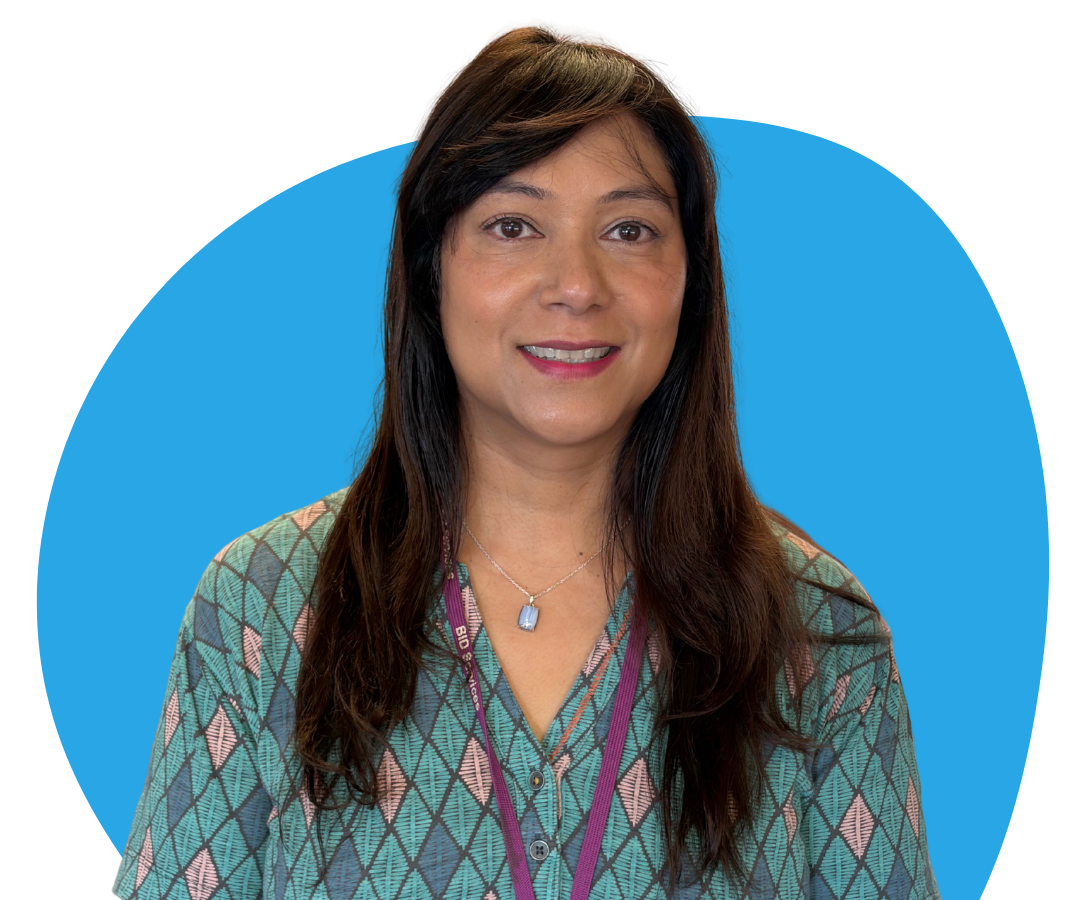 An Asian woman with long, straight, black hair against a light blue background.